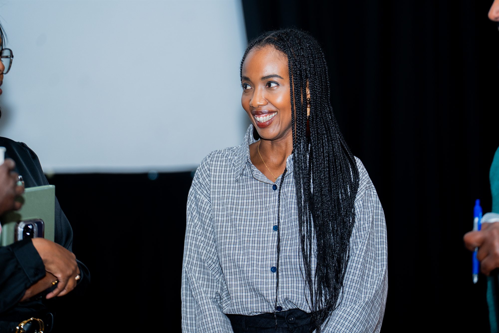 Adna Osman speaking at an event